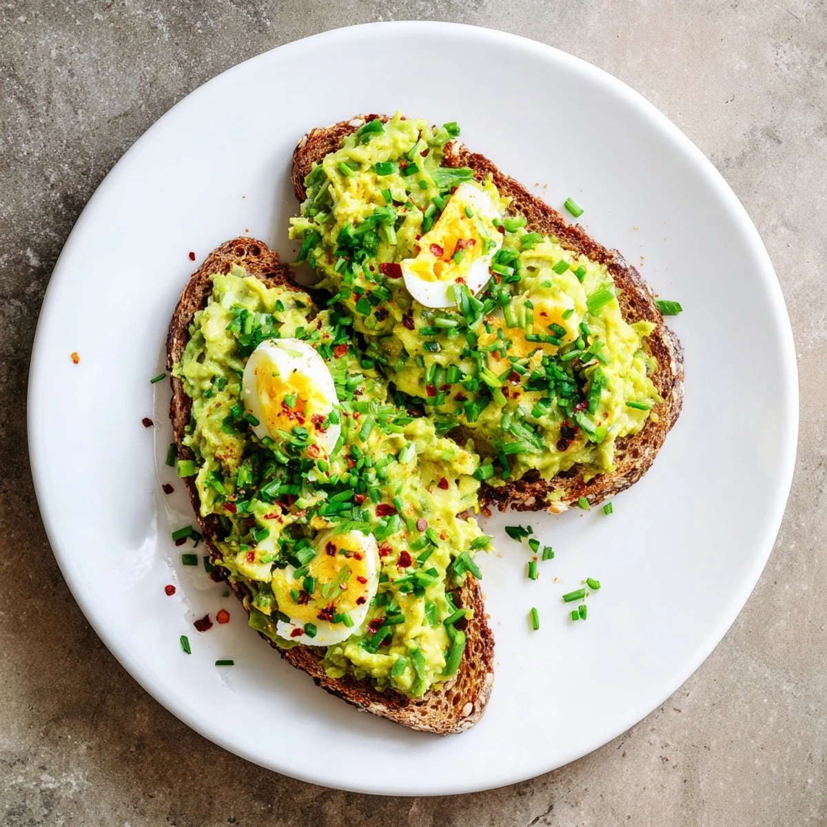 Creamy Avocado Egg Smash on toasted bread, a bright and flavorful breakfast delight.