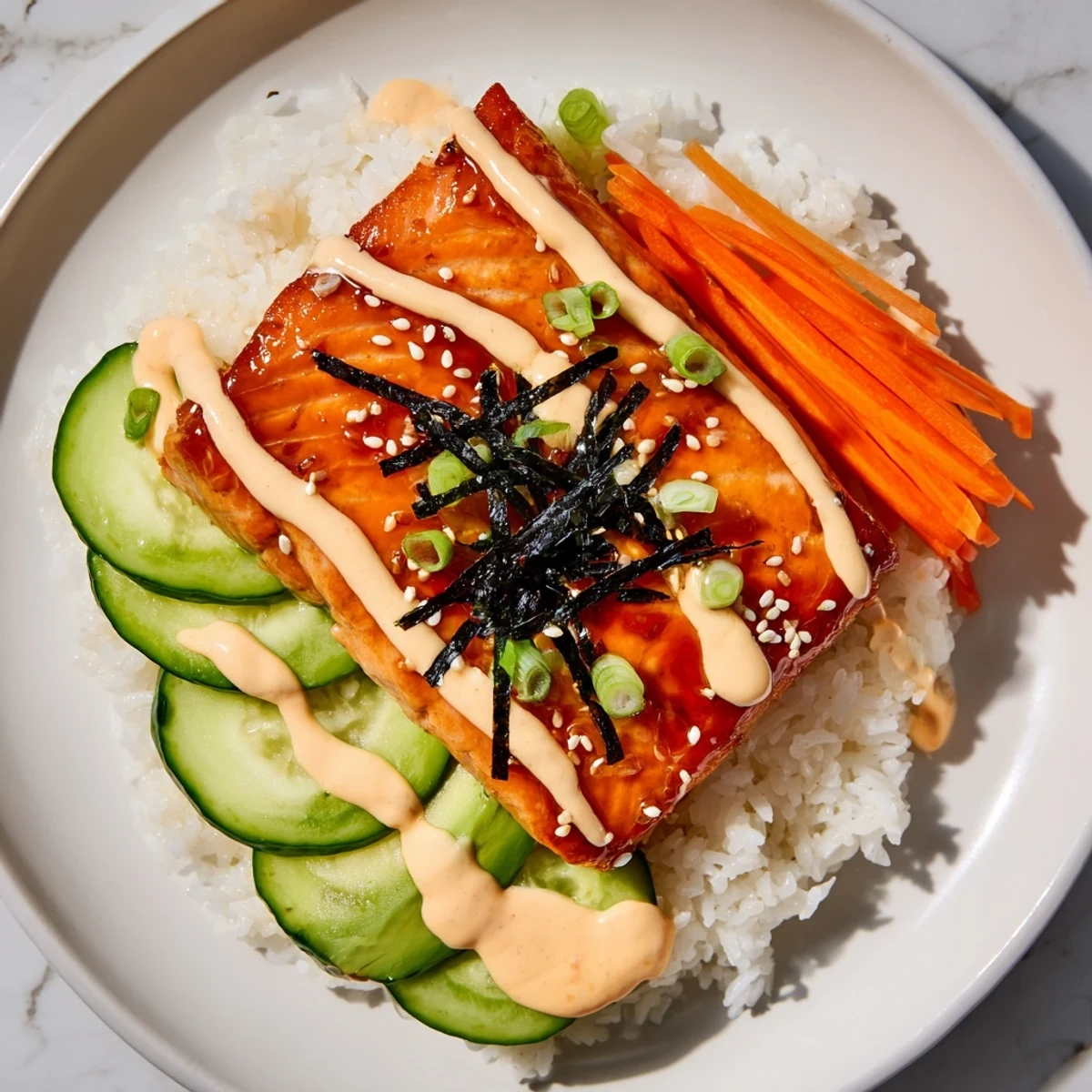 A mouthwatering teriyaki salmon rice bowl with glistening glazed salmon atop fluffy white rice.