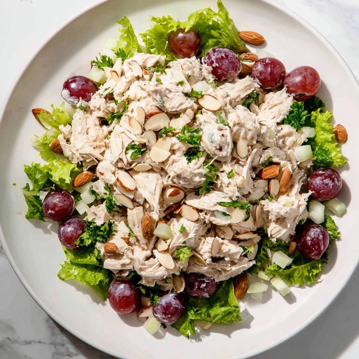 Crispy chicken salad: A close-up view of creamy chicken salad with crisp celery pieces.