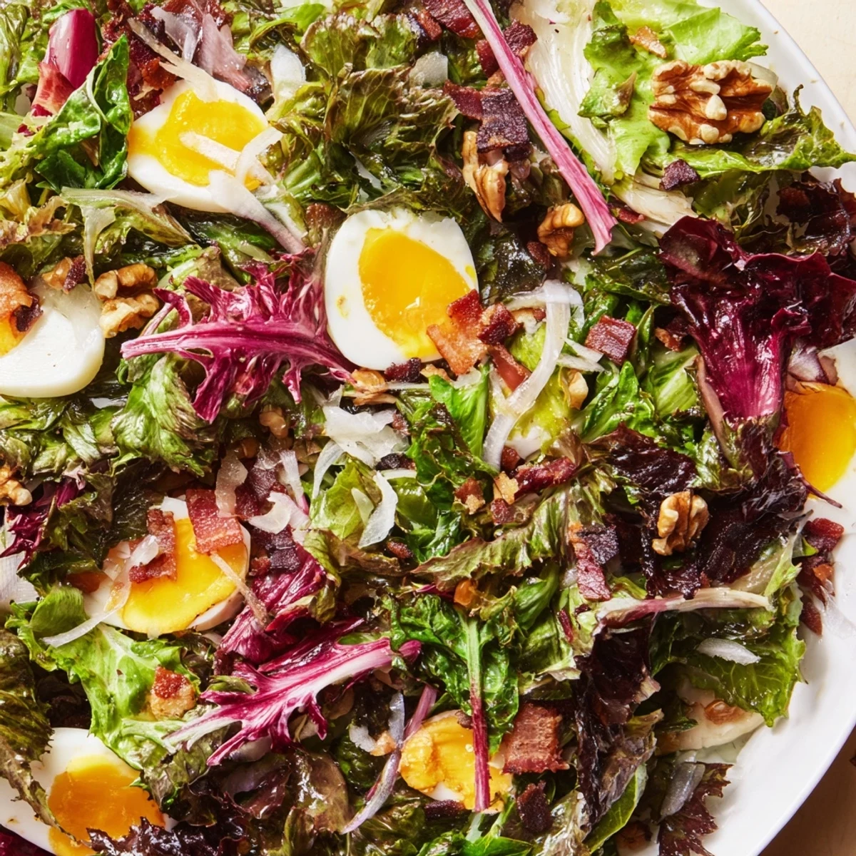 Vibrant Bitter Greens Salad with Warm Bacon Dressing, a delightful blend of textures and flavors.