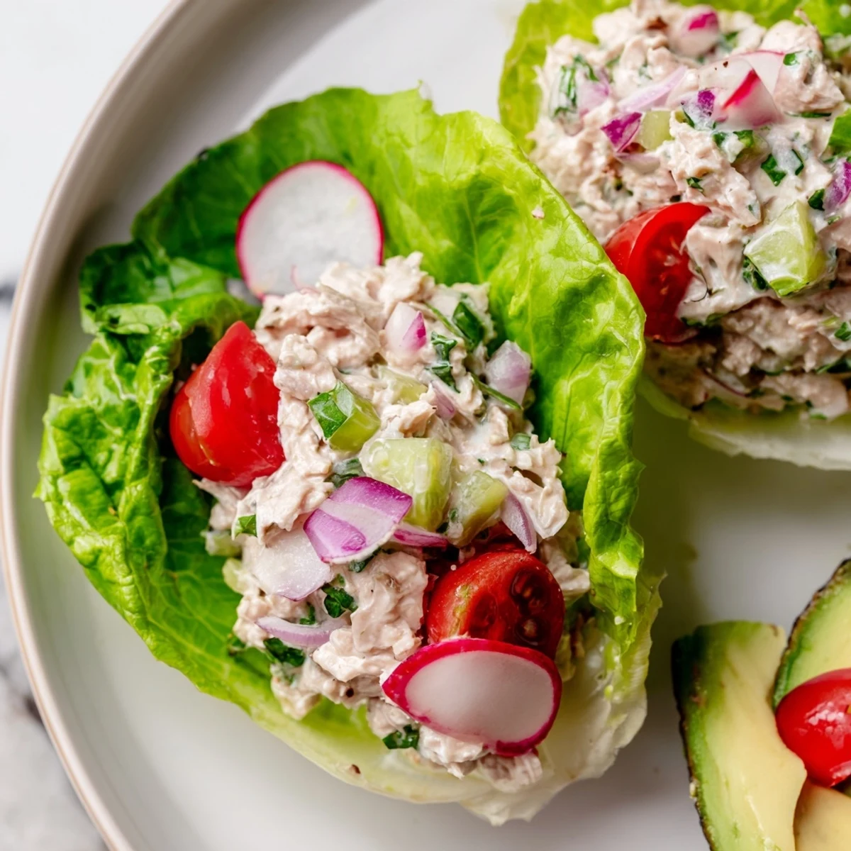 Vibrant tuna salad nestled in cool lettuce, a light and healthy Tuna Salad Lettuce Wrap.