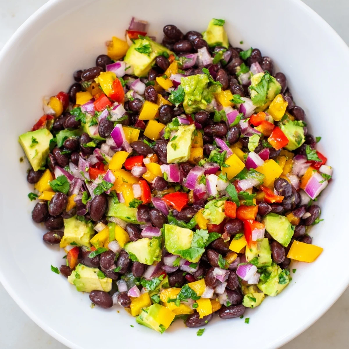 This vibrant Southwest black bean salad features sweet corn, red peppers, and a lime dressing.
