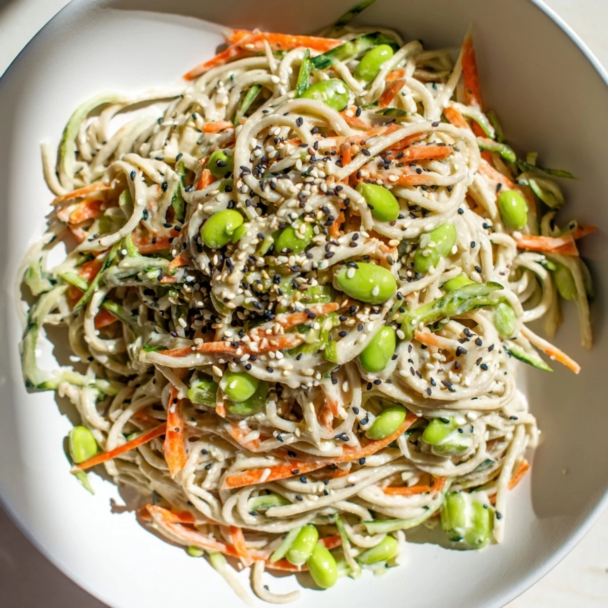 Close-up photo of Asian Sesame Noodle Salad; you can almost taste the nutty sesame flavor.