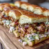 Juicy BBQ chicken sliders with tangy coleslaw on soft buns, perfect for Fourth of July BBQ parties.  