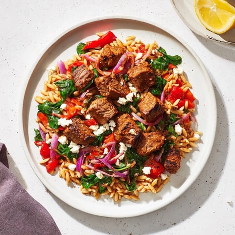 Savory Smoky Mediterranean Lamb and Orzo Supper is a delicious one-pot meal, steaming hot, ready to enjoy.