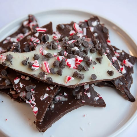 Dark and white chocolate Peppermint Bark shards, a crunchy and festive holiday dessert treat.