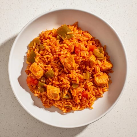 A close-up of the flavorful One-Pot Chicken and Rice, ready to serve with fresh cilantro.