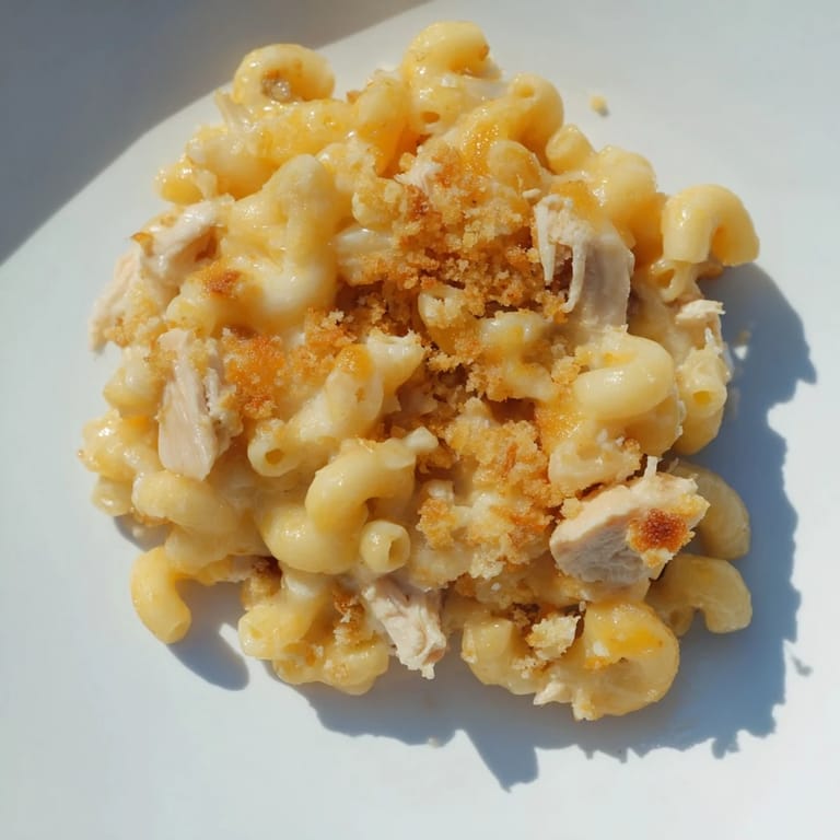 Hearty chicken macaroni, a budget-friendly meal with tender macaroni and cheesy sauce.