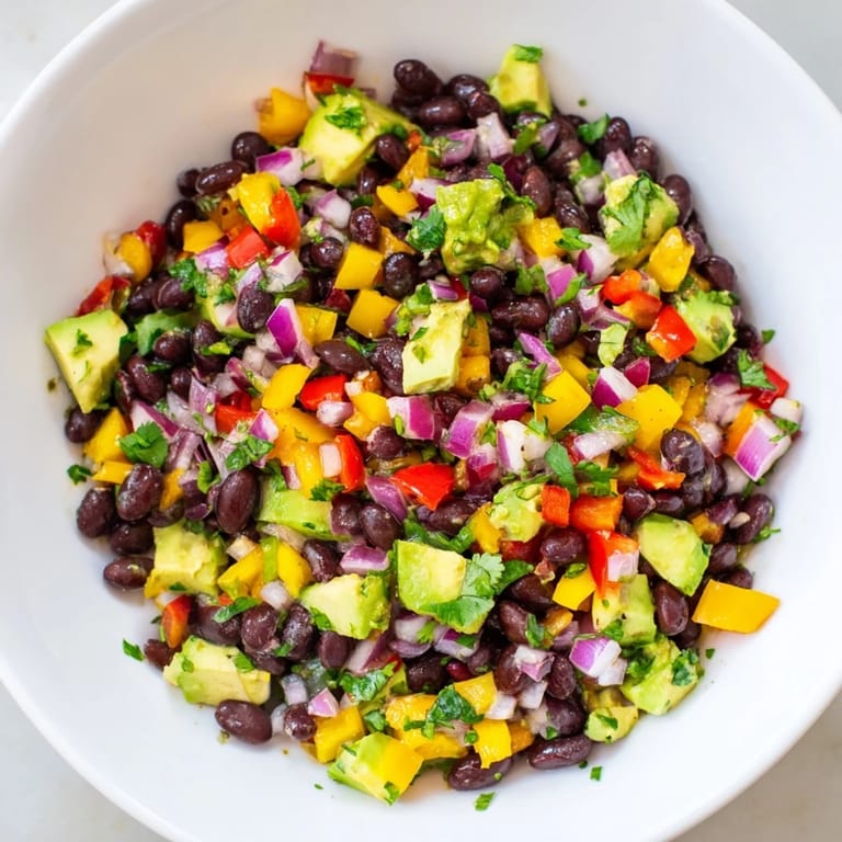 This vibrant Southwest black bean salad features sweet corn, red peppers, and a lime dressing.