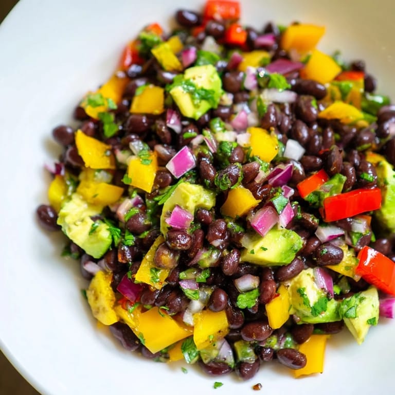 Enjoy a refreshing bowl of Southwest black bean salad with crunchy bell peppers and fresh cilantro.